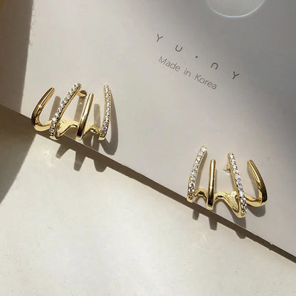 CLAW® ARETES DE LUJO ESTILO GARRA